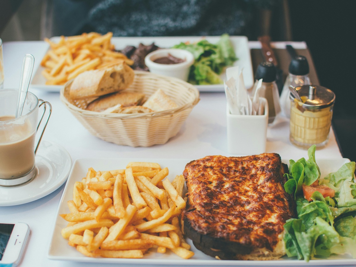 Golden, crispy croque-monsieur sandwich served hot, a symbol of French cuisine.