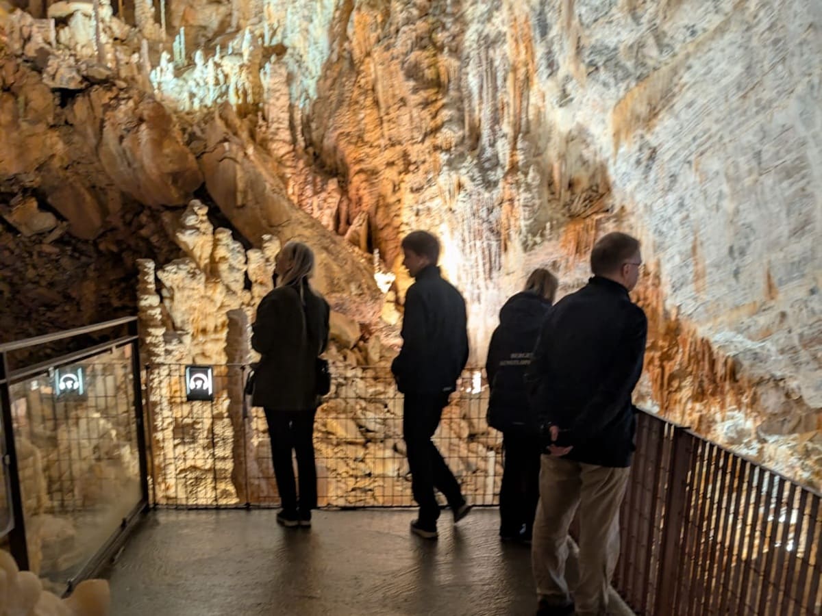 Picture of a family enjoying a visit in the Cabrespine Chasm in South of France during French immersion program with Eliane