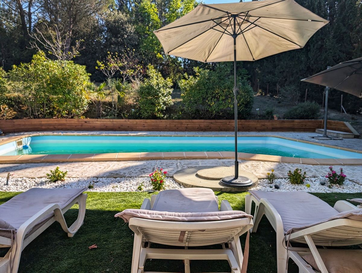 Private garden and swimming pool at French immersion house in Pezens in South of France
